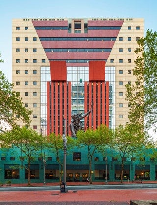 This image may contain Office Building Building City Town Urban High Rise Apartment Building Neighborhood and Housing