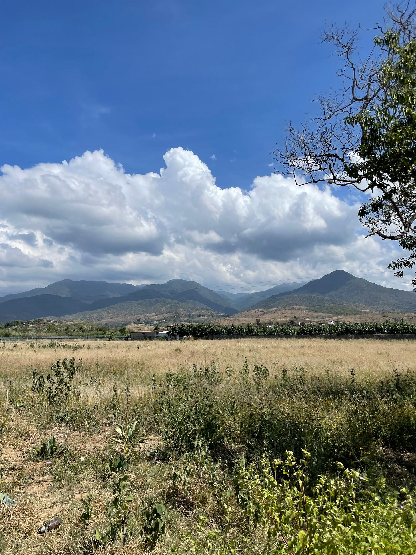 A view of the mountains which border our down, with a heavy cloud layer overhead.