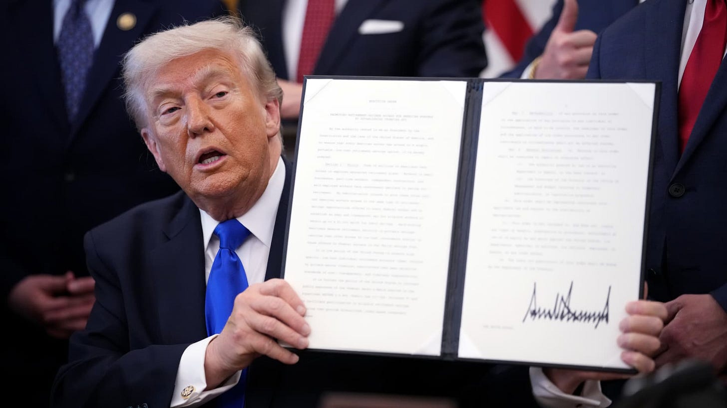 WASHINGTON, DC - APRIL 30: U.S. President Donald Trump holds up an executive order during an event in the Oval Office of the White House on April 30, 2026 in Washington, DC. President Trump signed an order to expand retirement account access for workers.  (Photo by Andrew Harnik/Getty Images)