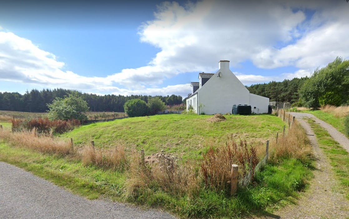 The cottage in front of the Kebbuck Stone, situated on a mound
