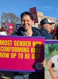 A person holding a sign

AI-generated content may be incorrect.