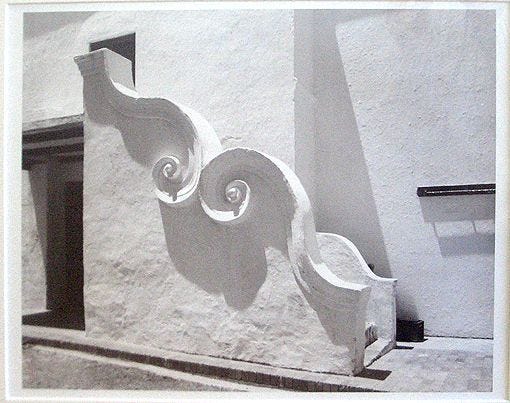 This may contain: an architectural design on the side of a building in black and white, with no people around it This may contain: an architectural design on the side of a building in black and white, with no people around it