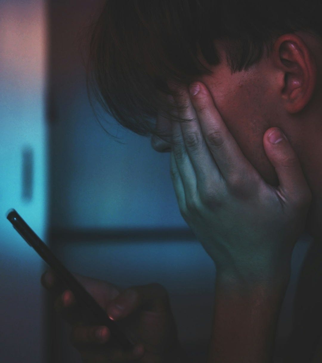 man holding smartphone in close up photography man holding smartphone in close up photography