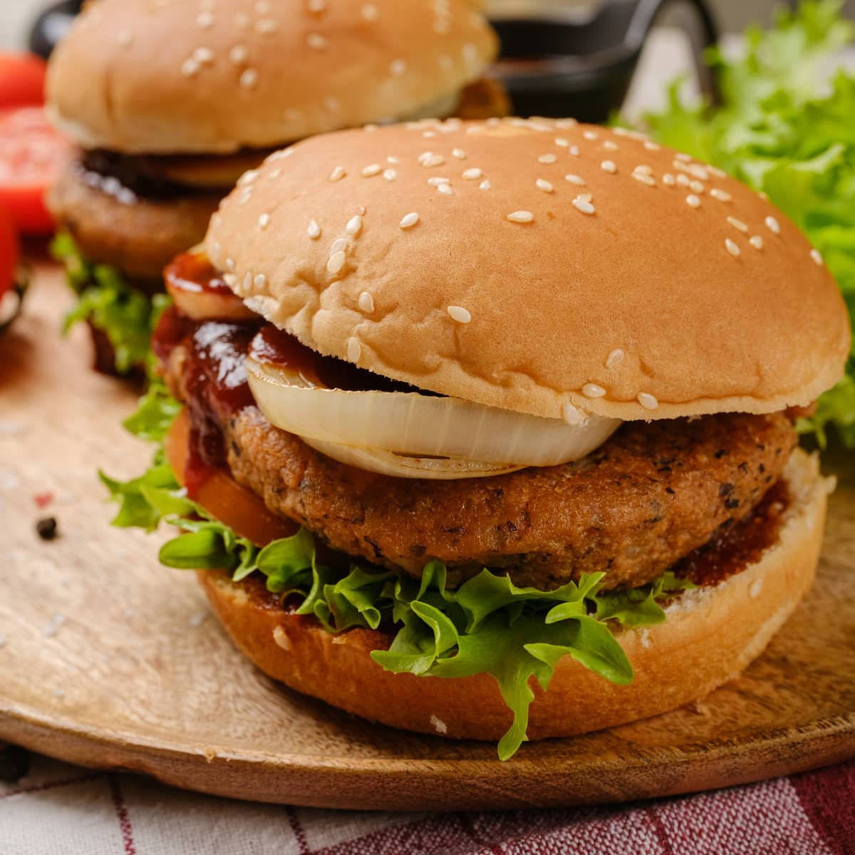 Chipotle black bean burgers in buns with barbecue sauce.