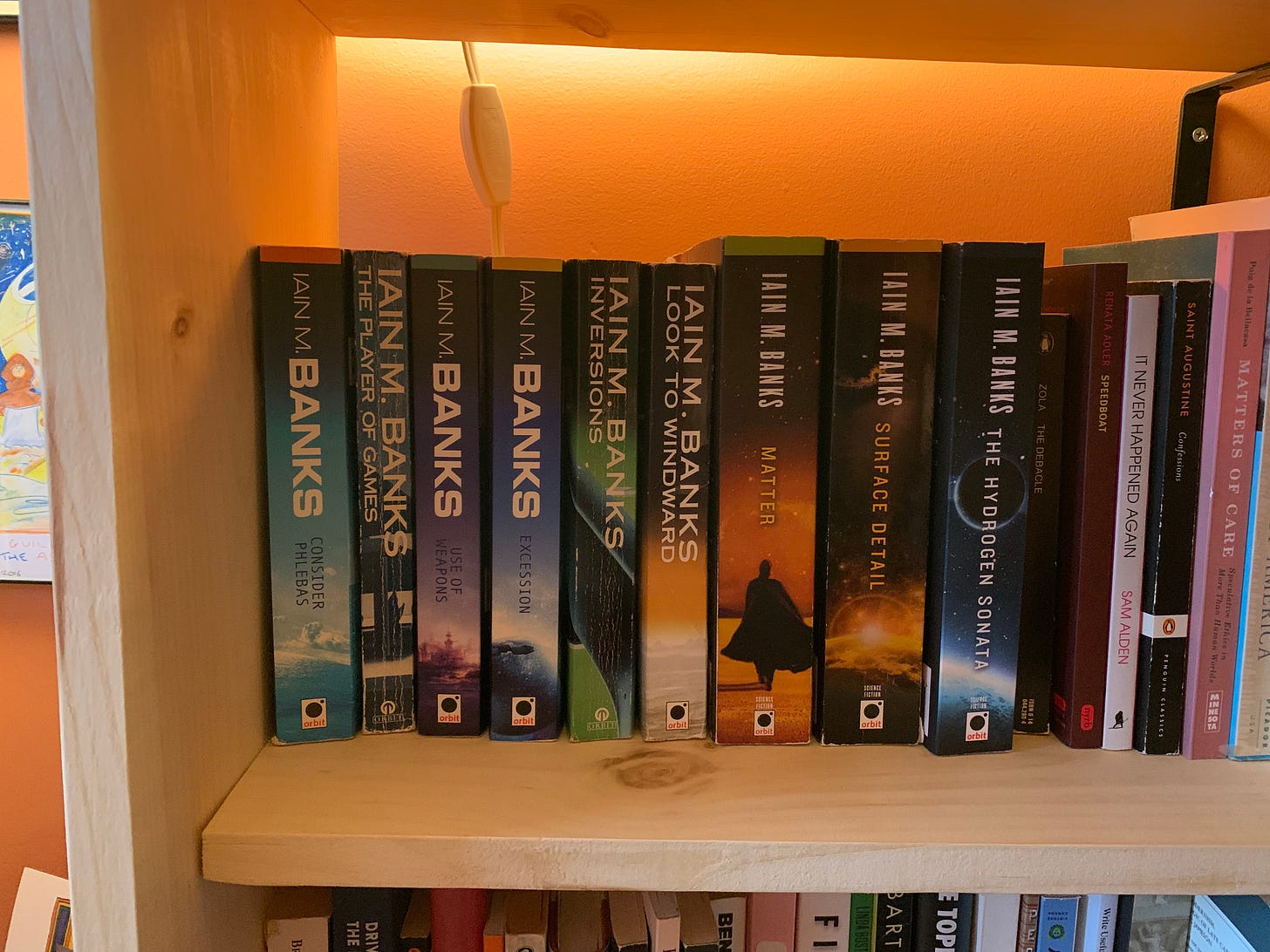 The nine novels of the Culture series on a shelf