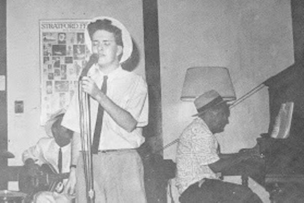 Author using microphone to amplify Hard Hearted Hannah Author using microphone to amplify Hard Hearted Hannah
