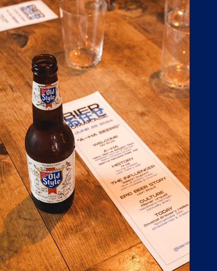 Photo of an Old Style next to the menu for Bier Omakase: A-Ha Beers