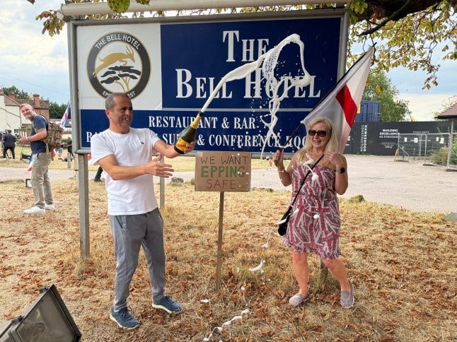 w8media. NO CREDIT w8media The Bell Hotel Epping. Police and jubilant protestors gather outside there hotel . 19/08/2025.