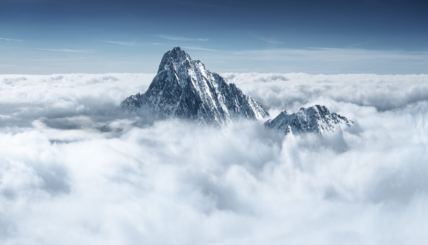 Mountain above clouds