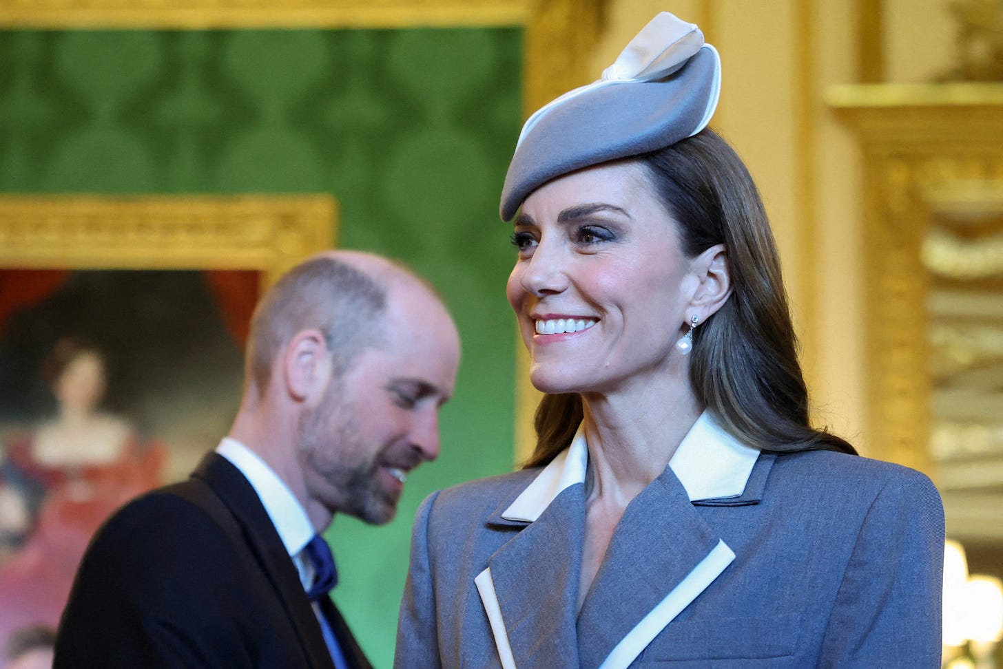 Princess Kate wearing a grey co-ord and smiling