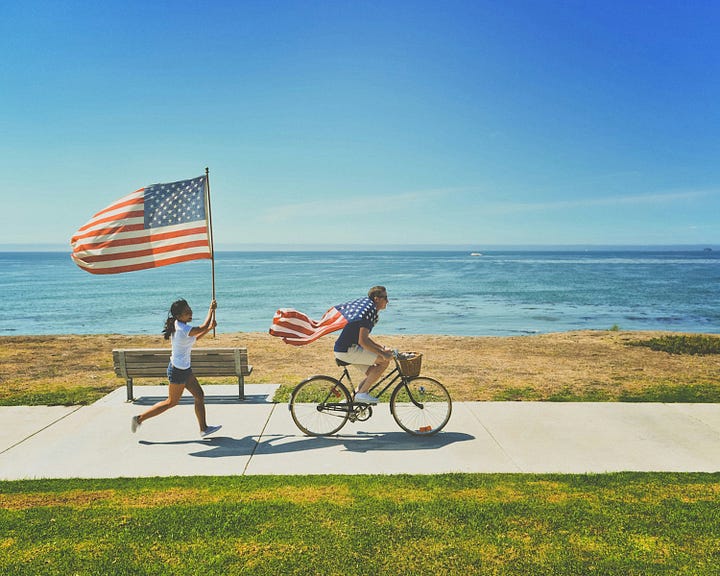 People with U.S. flags. Photo by frank mckenna via Unsplash. Watermelon lemonade from this recipe.