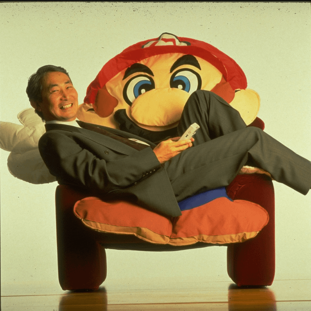 Throwback: Then-NOA President Minoru Arakawa playing the Gameboy on a Mario  chair in 1993. : r/nintendo