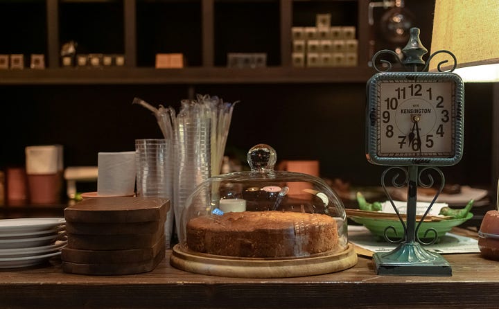 A pie on a countertop with a clock. Photo by Ashkan Forounzani via unsplash.