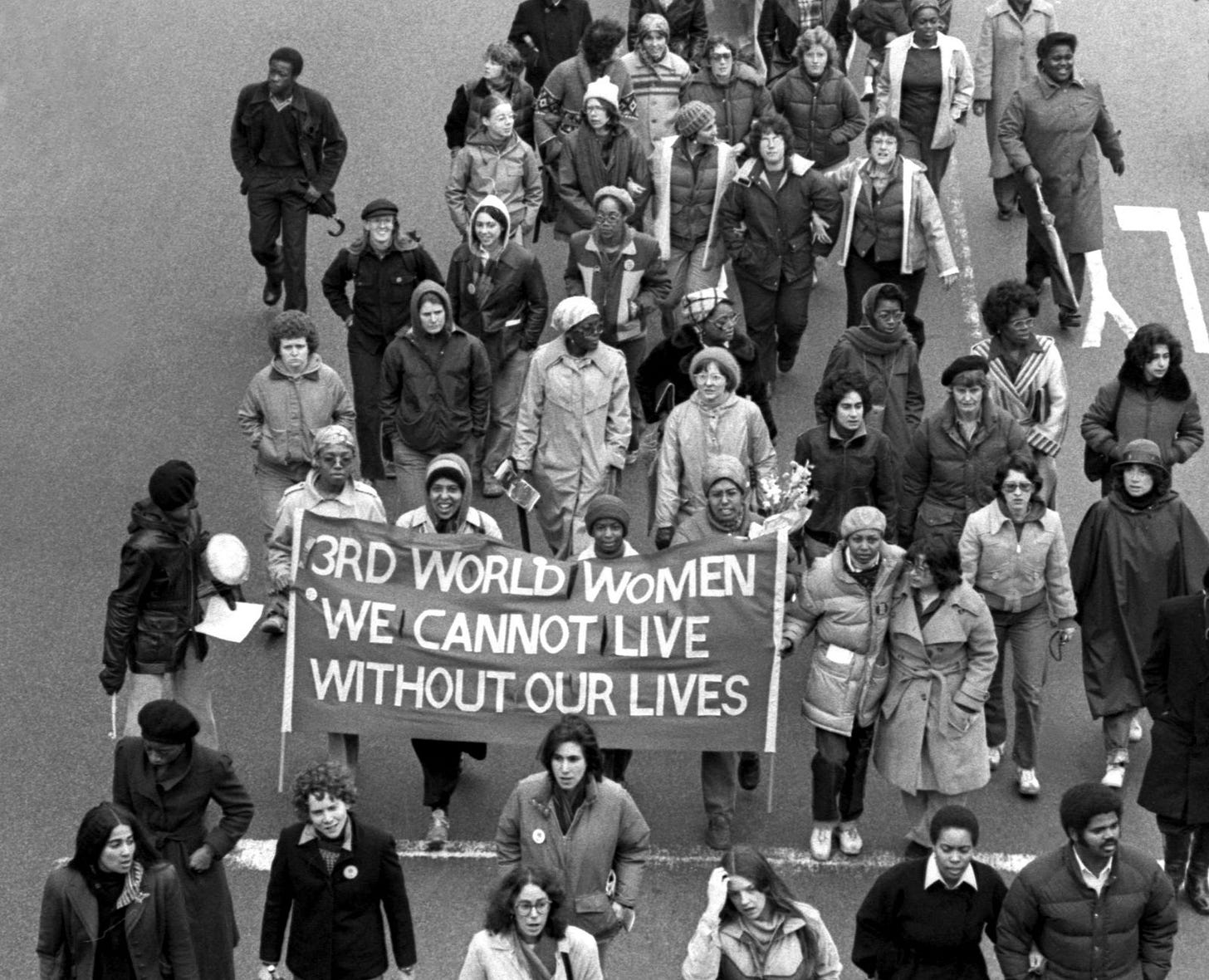 Combahee river collective with banner marching on Massachusetts Avenue at memorial march for murdered women of color...