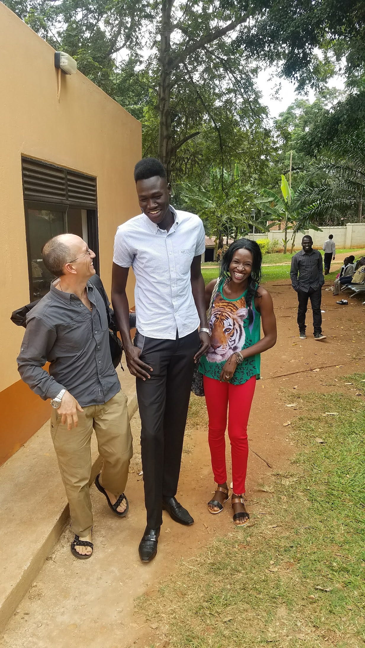 In Kampala, Uganda, at the South Sudan embassy, we met my first South Sudanese. They're known to be tall. He didn't disappoint.