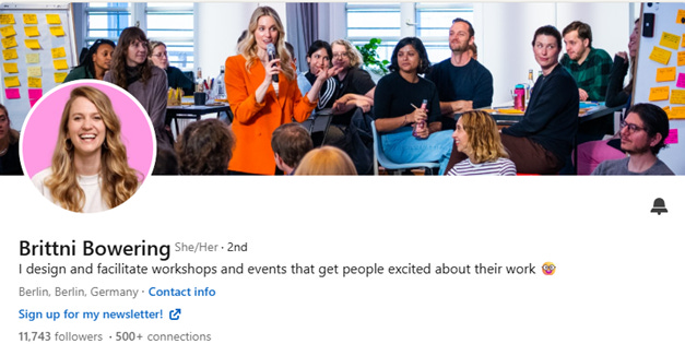 A person speaking into a microphone with people sitting around

AI-generated content may be incorrect.