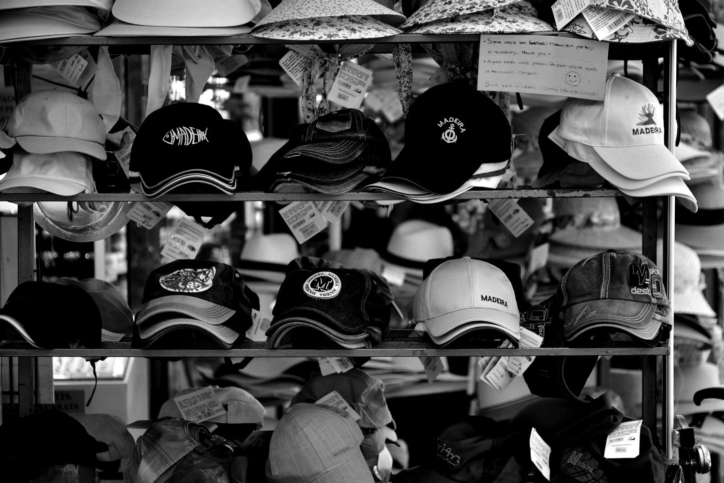 a rack of hats for sale in a store a rack of hats for sale in a store