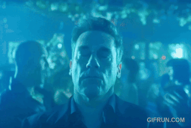 a man dancing in a club with a gifrun.com watermark