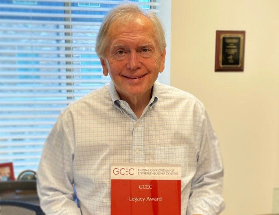 Michael Morris displaying the 2021 GCEC Legacy Award