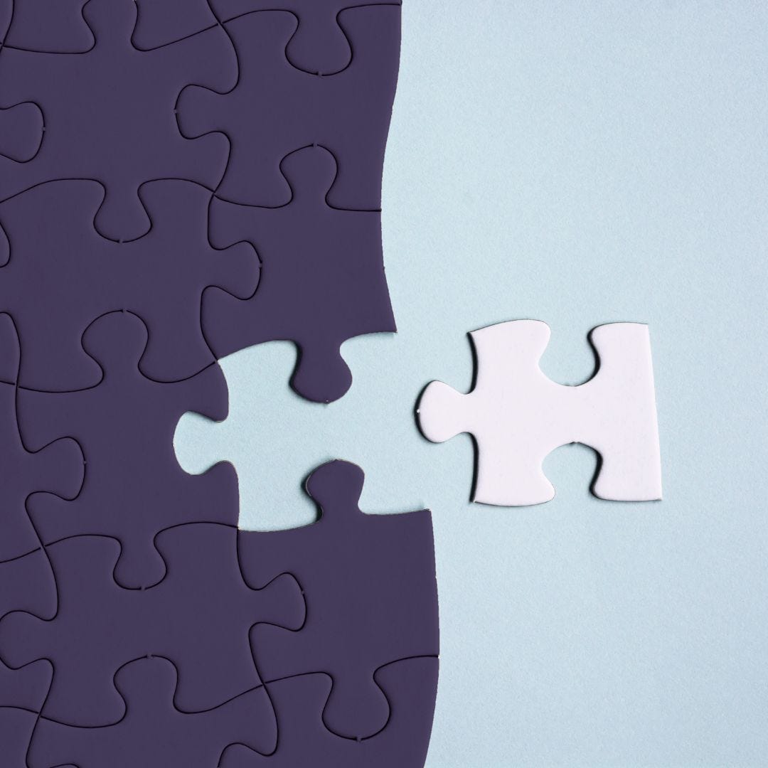 an almost complete purple puzzle with one final white puzzle piece about to fit in place, via Canva