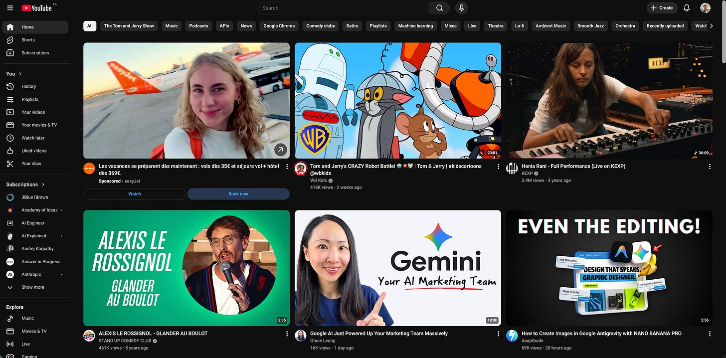 A screenshot of a cluttered YouTube homepage in dark mode, showing a disjointed mix of content including an airline advertisement, a Tom and Jerry cartoon, and various tech and music videos.