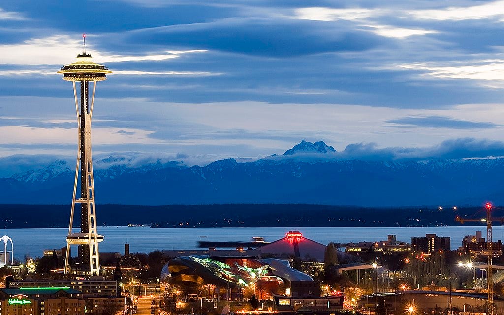 Space Needle with the Olympic Mountains in the background Space Needle with the Olympic Mountains in the background