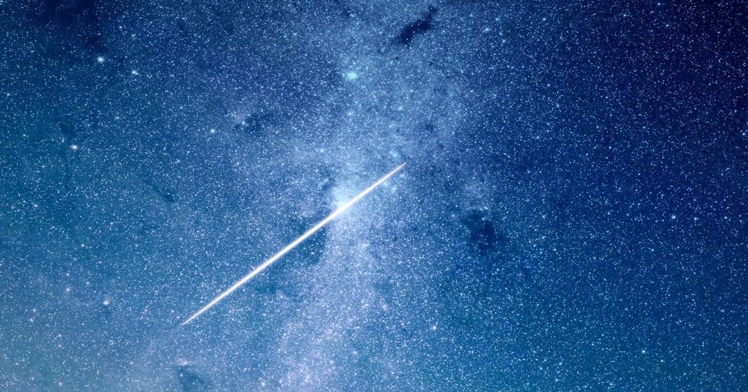 shooting star under blue sky