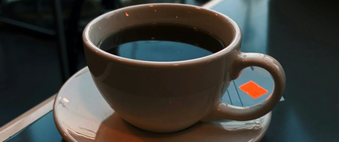 A cup of coffee sitting on top of a saucer