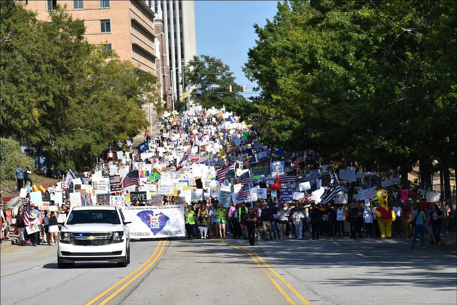 Thousands of protestors march through the streets of Columbia SC with signs Thousands of protestors march through the streets of Columbia SC with signs