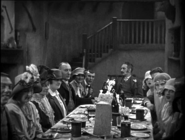 A group of people sitting at a table

Description automatically generated