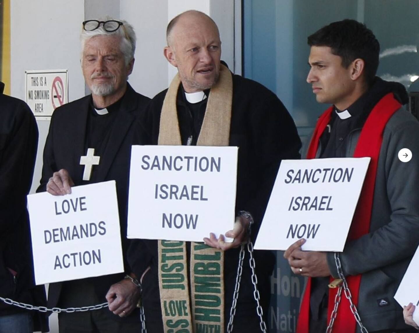 Priests protesting at Nicola Willis' office over Gaza.