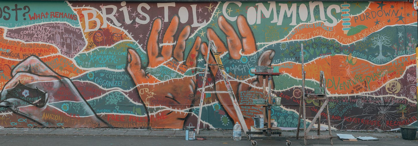 photo of Bristol Commons mural with ladders in front