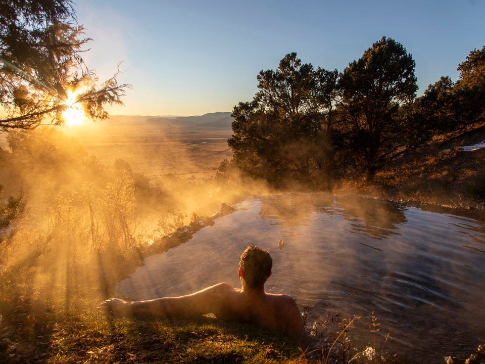 A man soaks at Valley View Hot Springs in Colorado
