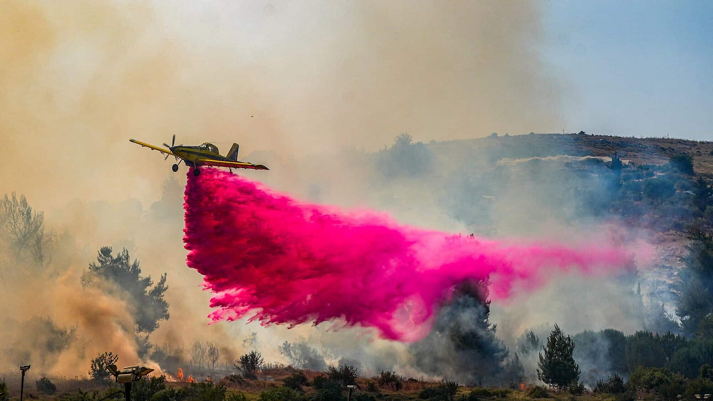 A firefighting plane tries to extinguish a large fire after missiles launched from Lebanon hit open areas near Kadita, close to Safed in the Galilee, June 12, 2024. Photo by Ayal Margolin/Flash90. A firefighting plane tries to extinguish a large fire after missiles launched from Lebanon hit open areas near Kadita, close to Safed in the Galilee, June 12, 2024. Photo by Ayal Margolin/Flash90.