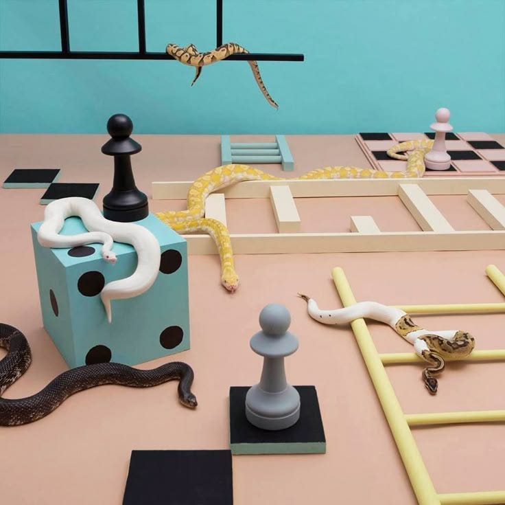 This may contain: an assortment of chess pieces and snakes on a table