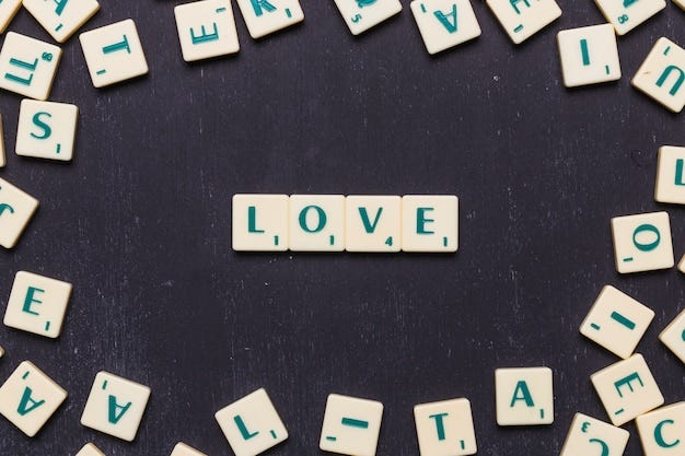 Love word arranged on black background surrounded by scrabble letters