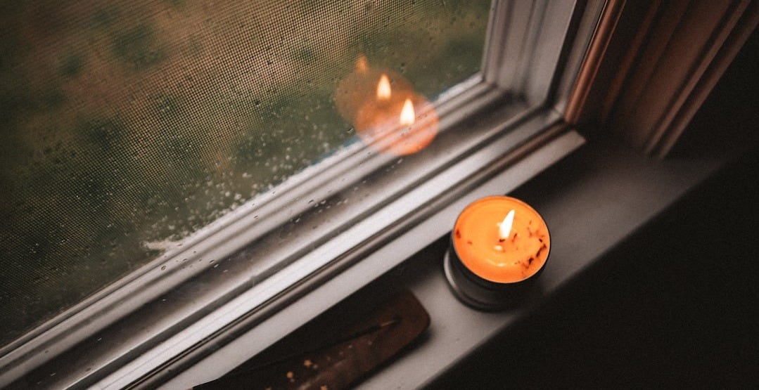 orange pumpkin on window during daytime