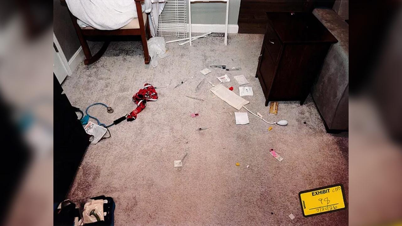 Toddler pajamas, some medical equipment and dried blood were on the floor. Toddler pajamas, some medical equipment and dried blood were on the floor.