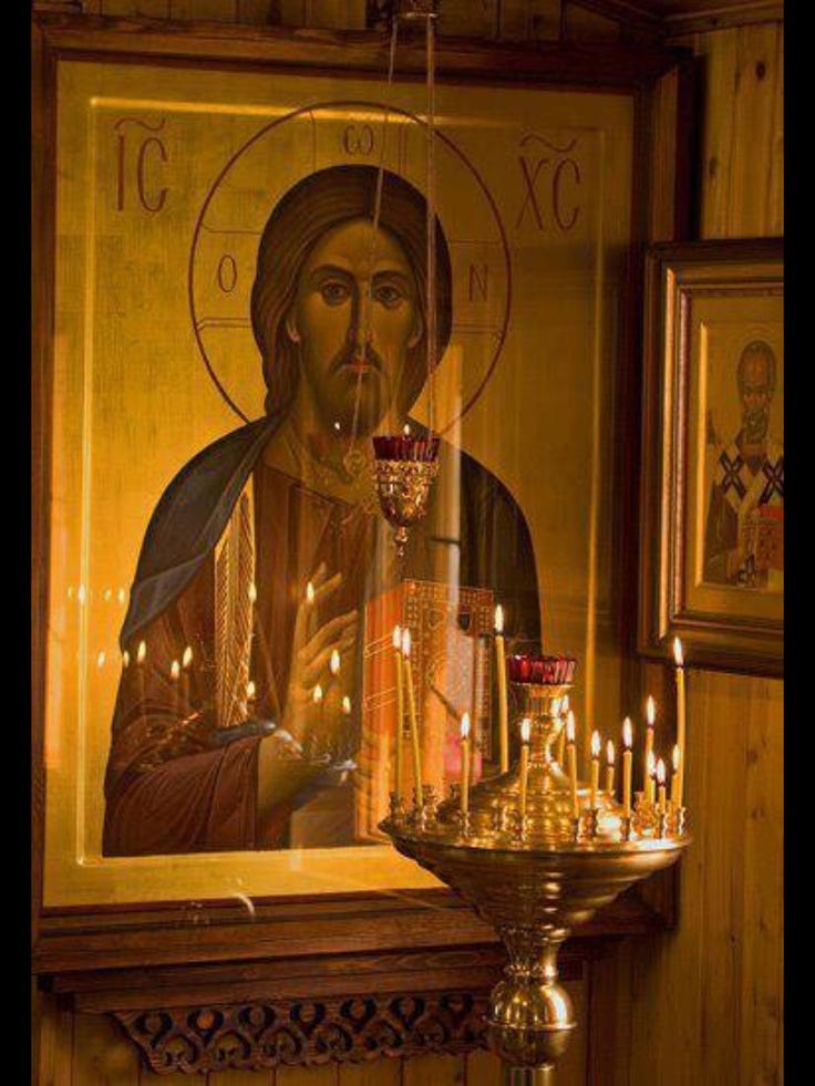 Worshipping in front of the icon of Christ