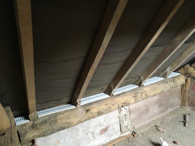 Dwarf wall, sloping ceiling, and newly fitted white pvc soffits closing the gaps.