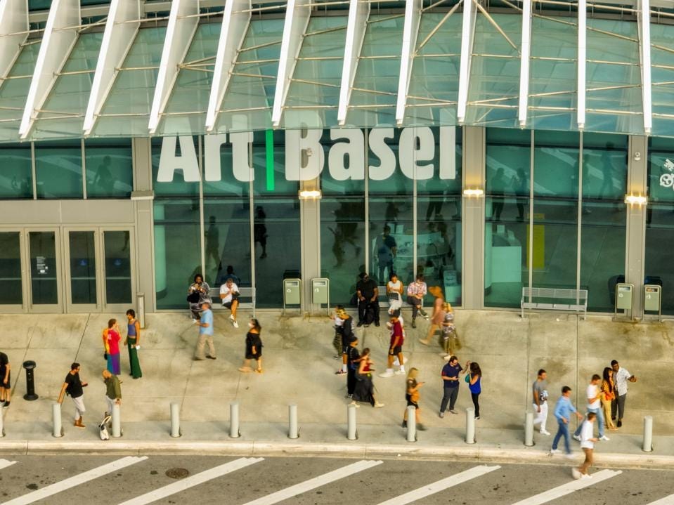 Aerial photo people walking by the Art Basel Miami Beach