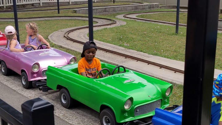 Riding green car and musical ride
