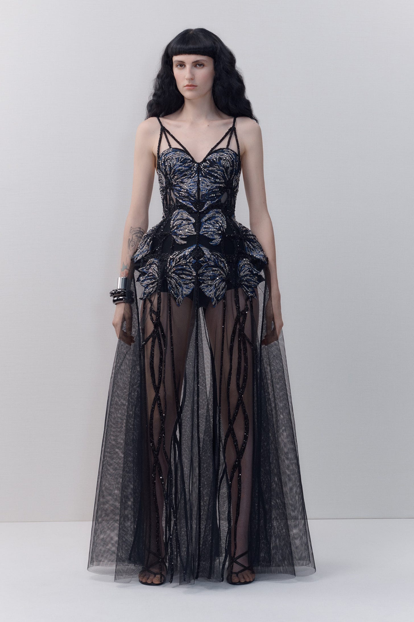 Image may contain Clothing Apparel Dress Evening Dress Gown Robe Fashion Human and Person