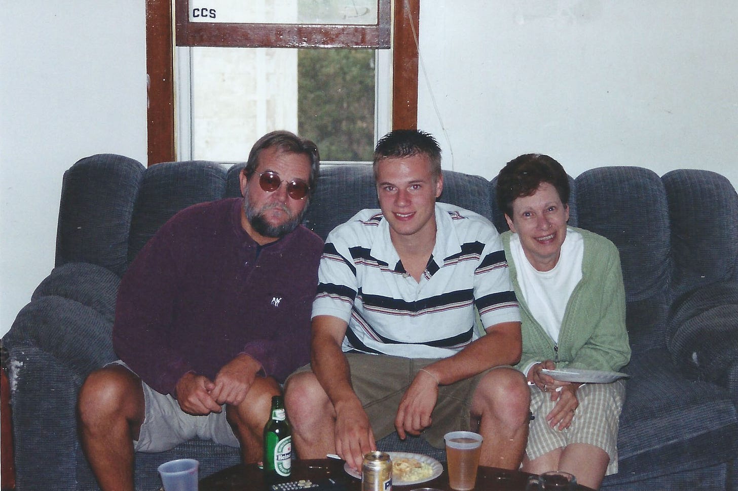 Wes Fox and his parents sitting on the couch with snacks and beverages in the early 2000s Wes Fox and his parents sitting on the couch with snacks and beverages in the early 2000s