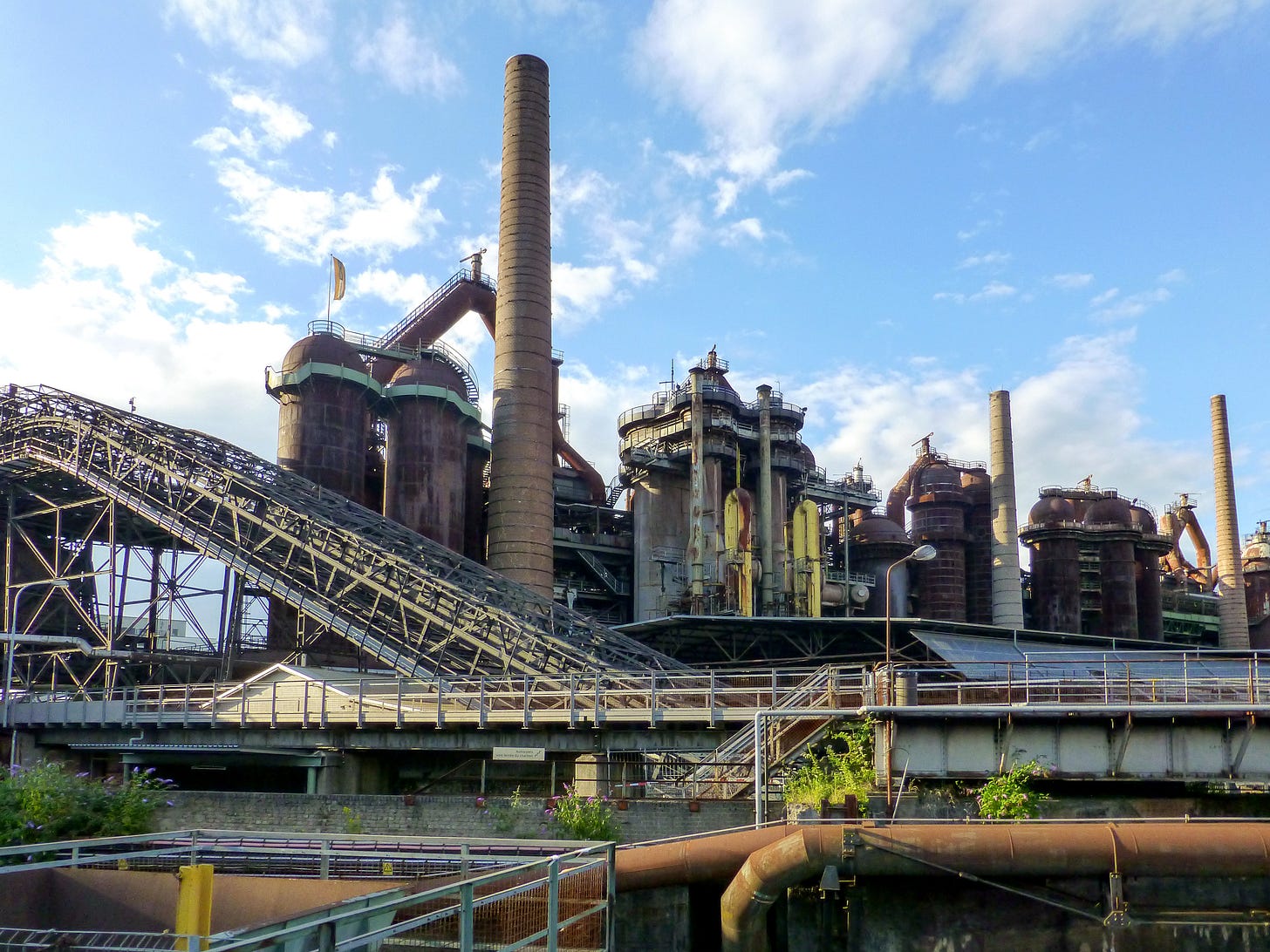 Aging rusty mill or refinery. I'm a working class kid, but I'm not well versed in every type of sprawling manufacturing behemoth. It looks like it stinks.