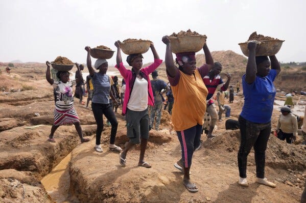 Women work at an Illegal tin mining site in Jos, Nigeria, Wednesday, April 3, 2024. The recent arrests come as Nigeria seeks to regulate mining of critical minerals, curb illegal activity and better benefit from its mineral resources. (AP Photo/Sunday Alamba) Women work at an Illegal tin mining site in Jos, Nigeria, Wednesday, April 3, 2024. The recent arrests come as Nigeria seeks to regulate mining of critical minerals, curb illegal activity and better benefit from its mineral resources. (AP Photo/Sunday Alamba)