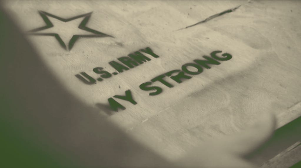 The U.S. Army Army Strong logo spray painted onto a crate in MTV's The Challenge: The Island The U.S. Army Army Strong logo spray painted onto a crate in MTV's The Challenge: The Island