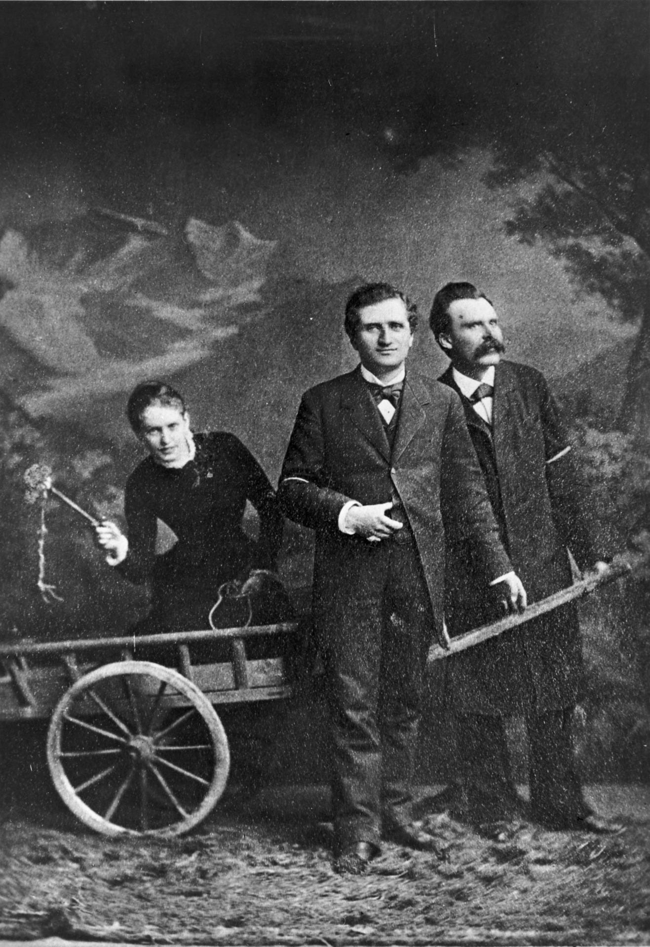 r/OldSchoolCool - Group picture with Friedrich Nietzsche, Paul Rée and Lou Andreas-Salomé, the latter kneeling in the car with a whip, Nietzsche and Rée pulling the car (May 1882)