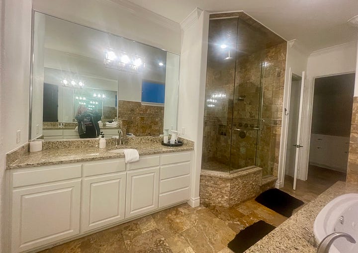 My photos of the master suite and it's amazing bathroom and the dining table that overlooks the lake.