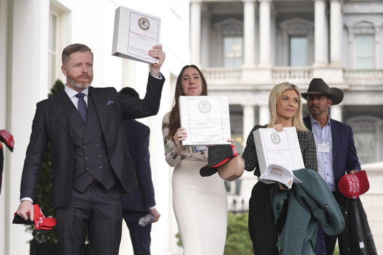 Attorney General Pam Bondi released documents on the Epstein case in February. Above, conservative influencers at the White House with the documents.